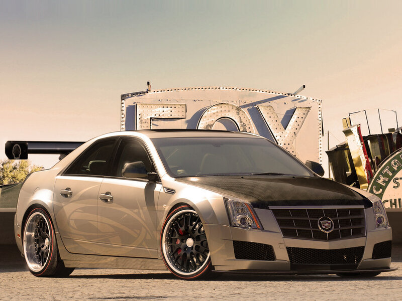 silver cadillac with carbon fiber hood