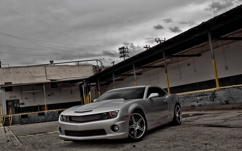 silver camaro in industrial lot