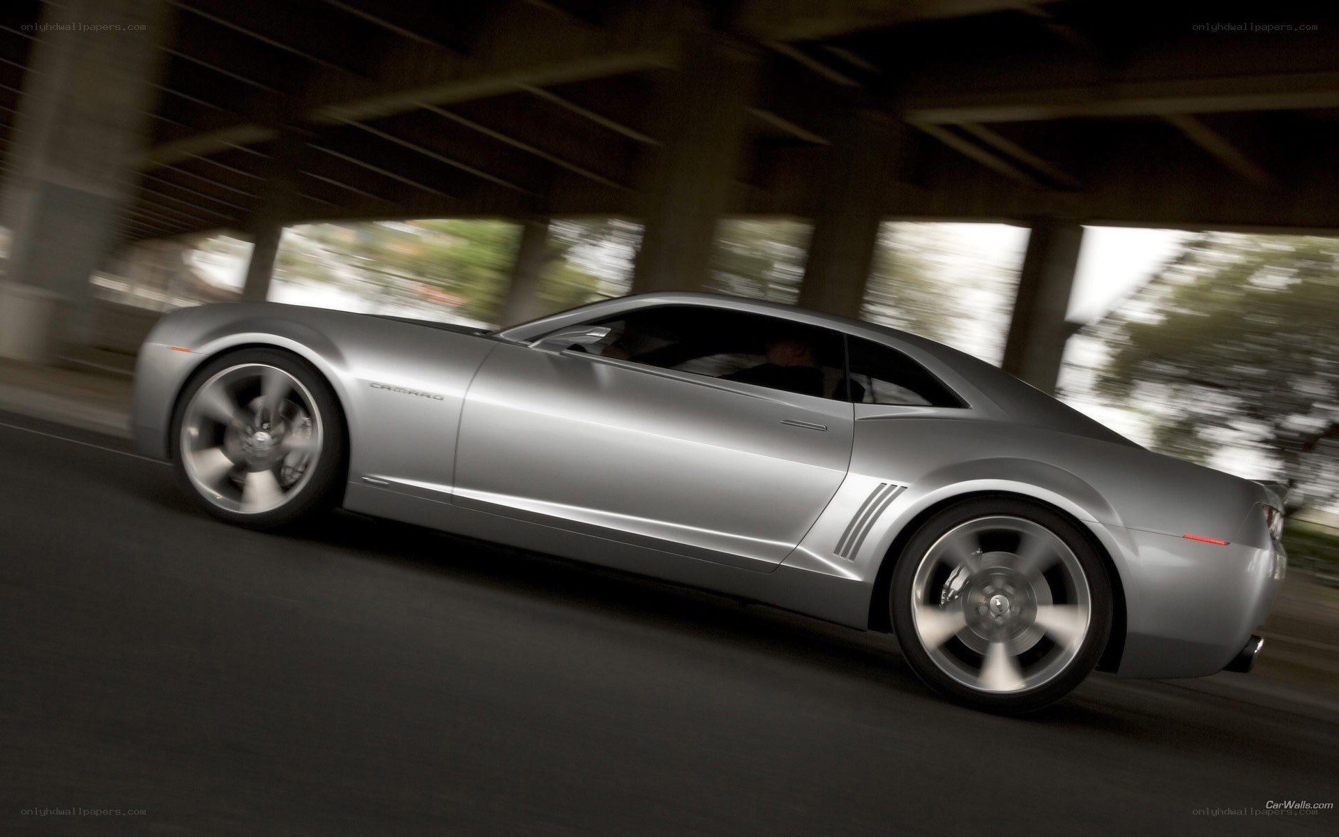 Silver Camaro in motion