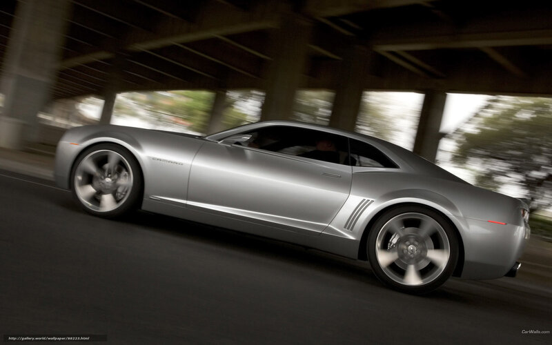 Silver Camaro in motion