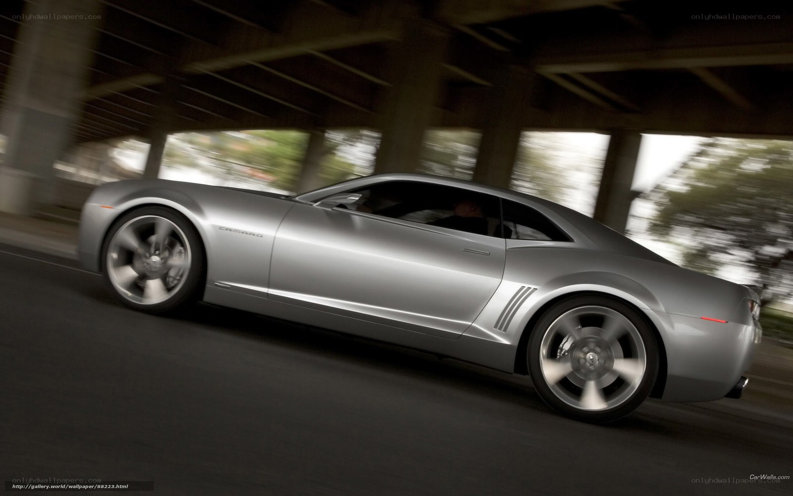 Silver Camaro in motion