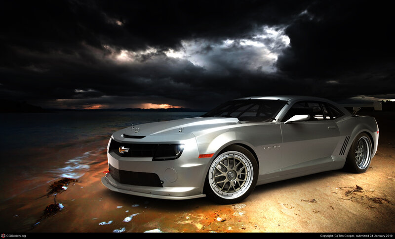 Silver Camaro on a stormy beach
