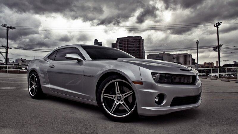 silver camaro on city street