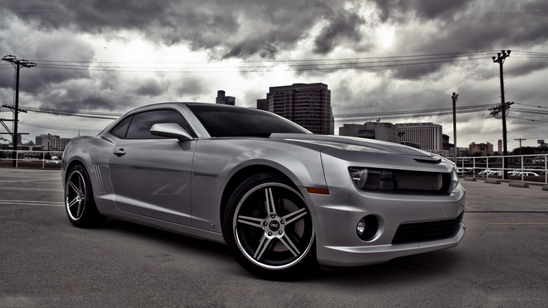 silver camaro on city street
