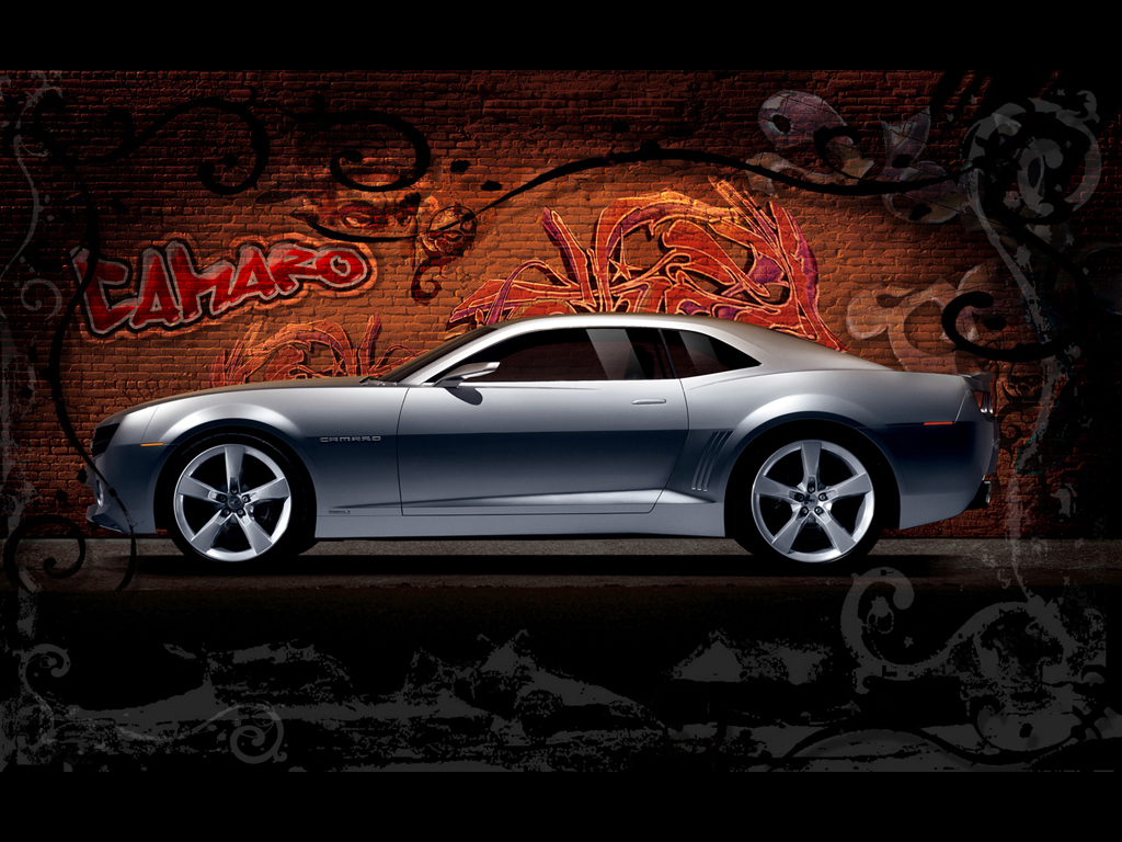 Silver Camaro on graffiti wall
