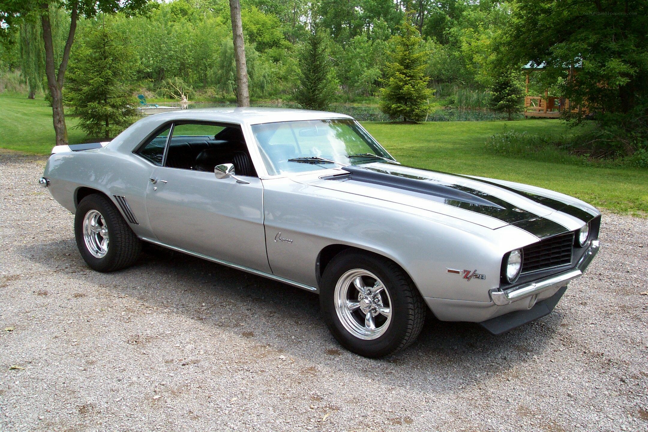 Silver Camaro with black stripes
