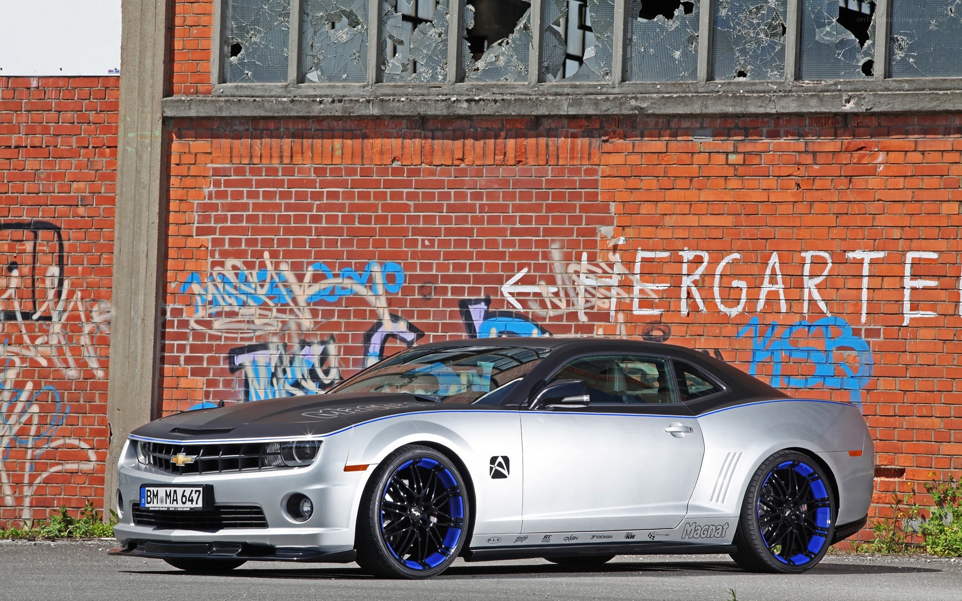 Silver Camaro with blue accents