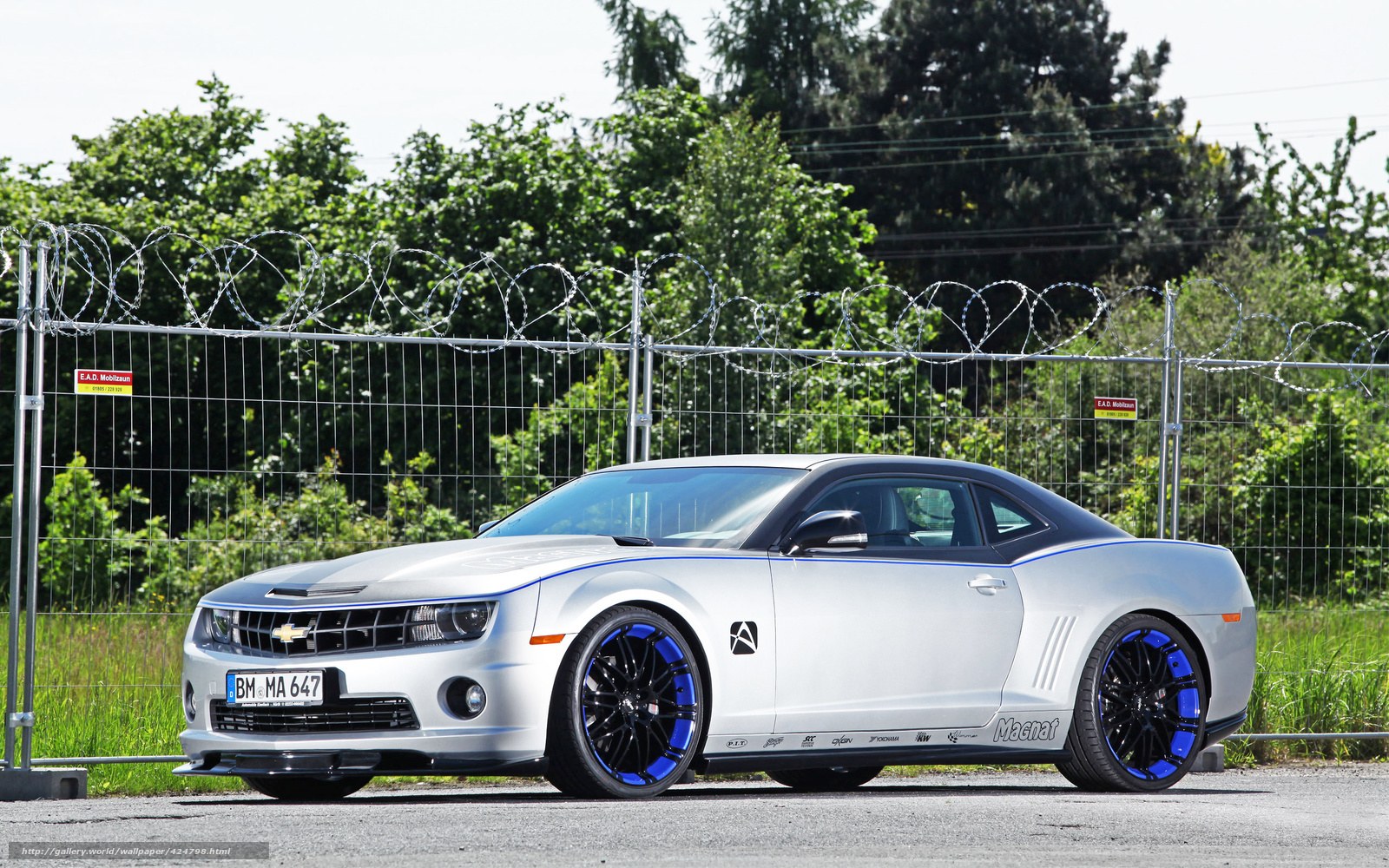 Silver Camaro with blue accents
