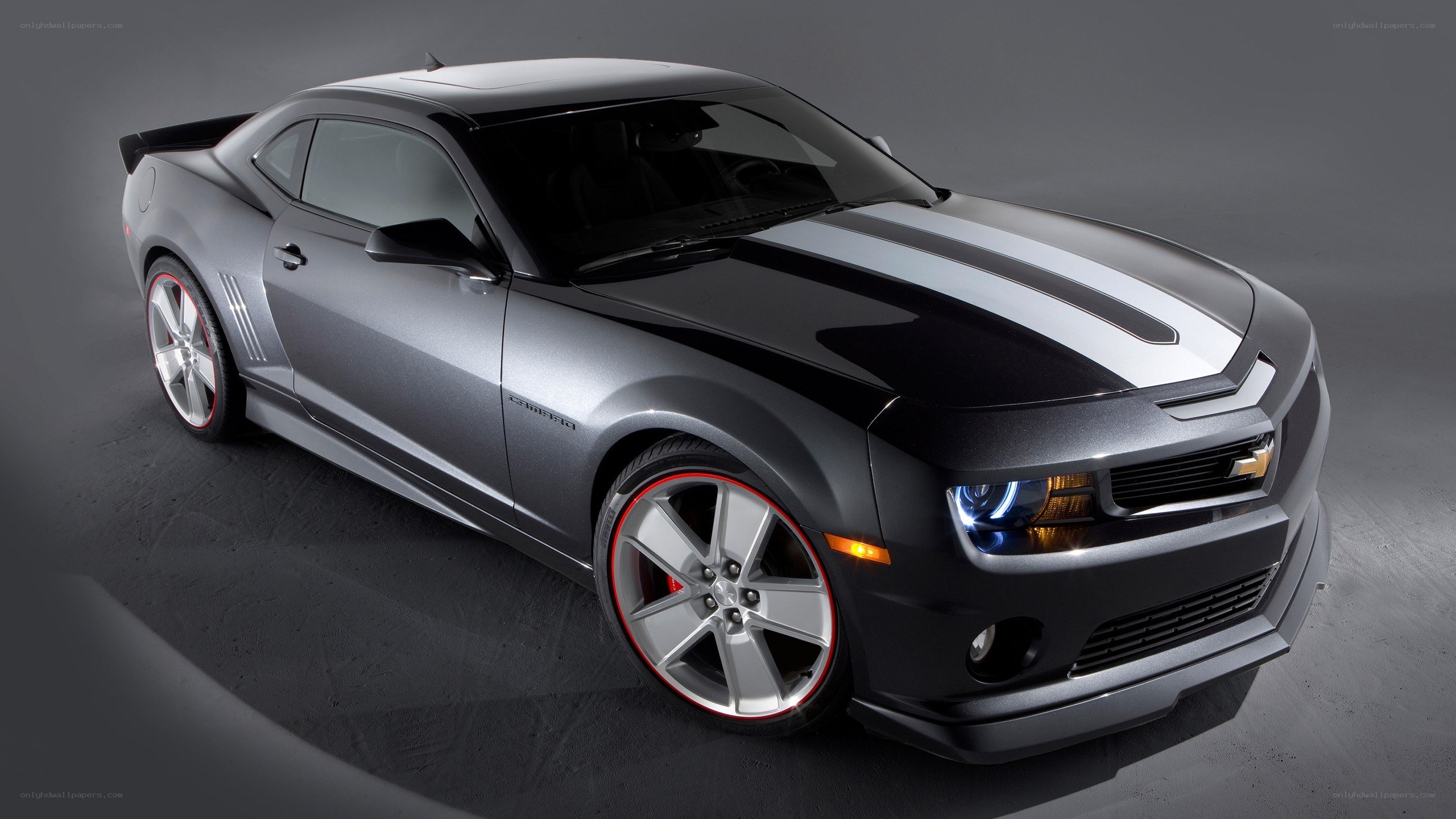 silver camaro with racing stripes