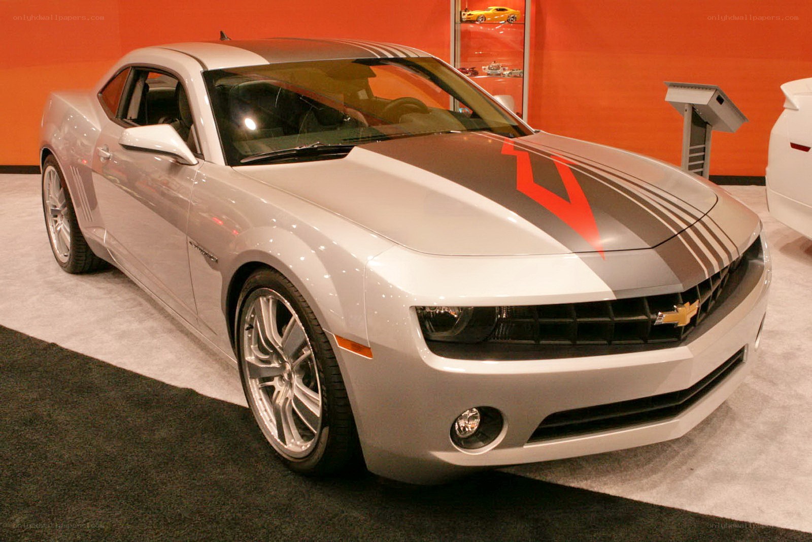 silver camaro with racing stripes
