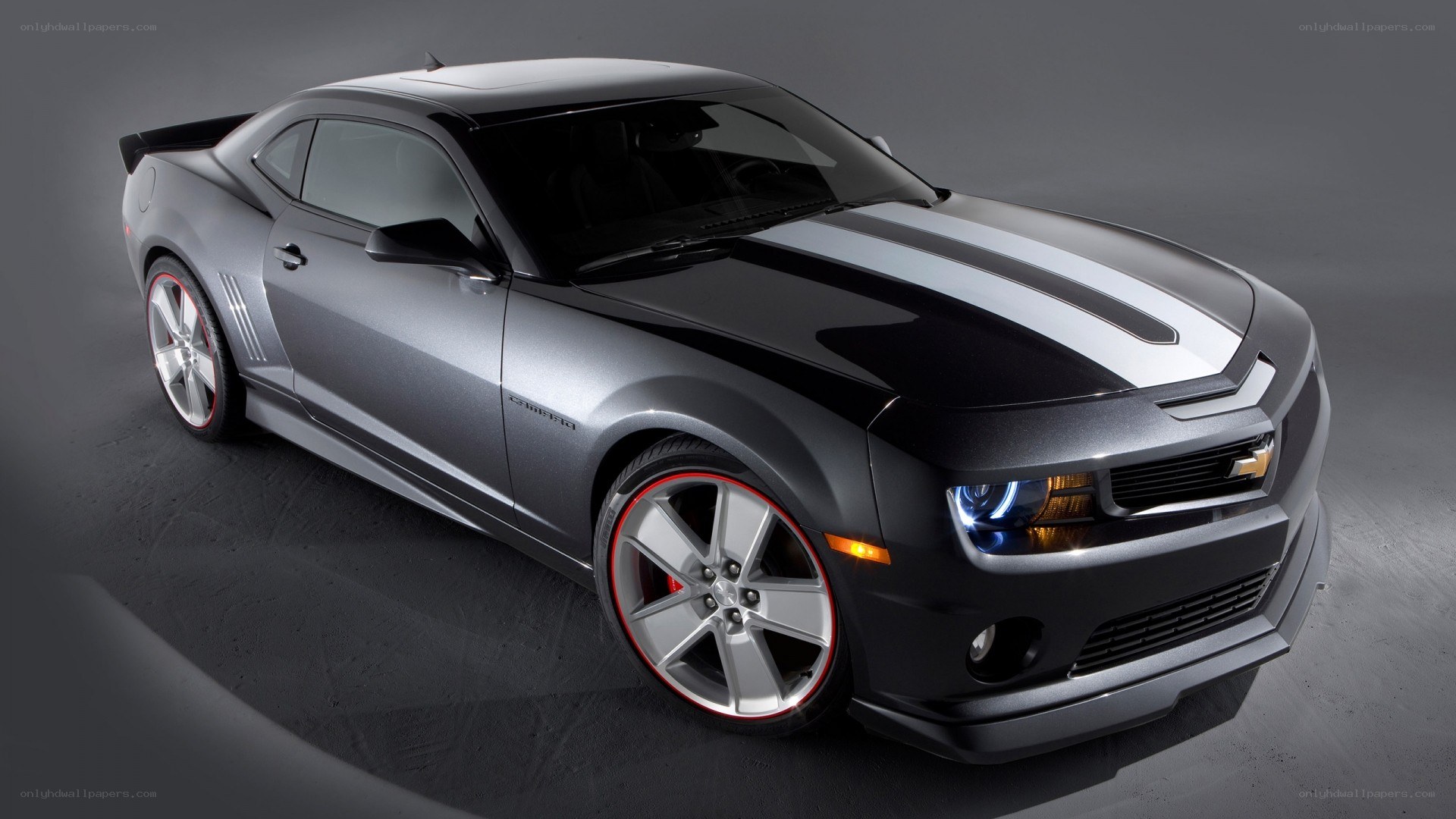 silver camaro with racing stripes