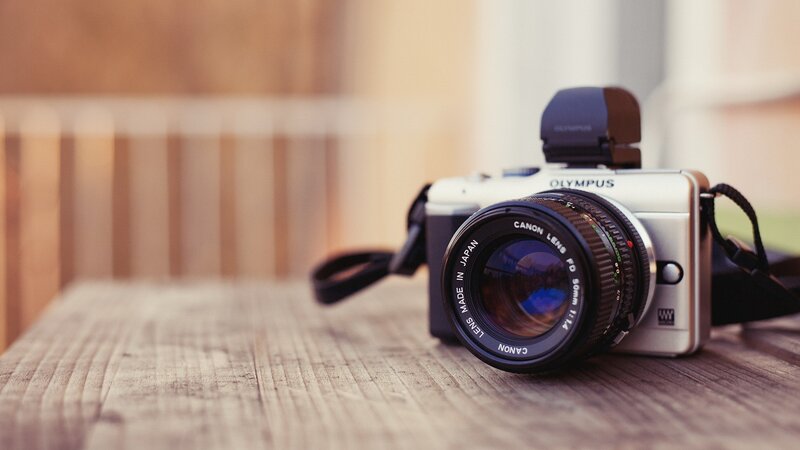 Silver Camera on Wood