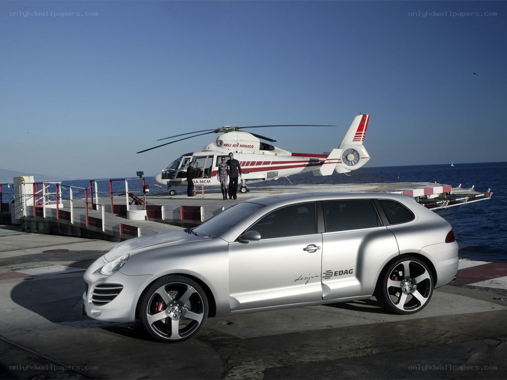 Silver car and helicopter at dock