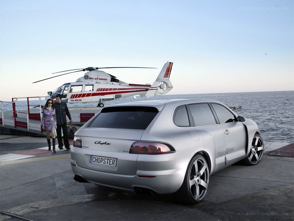 Silver car and helicopter at dock