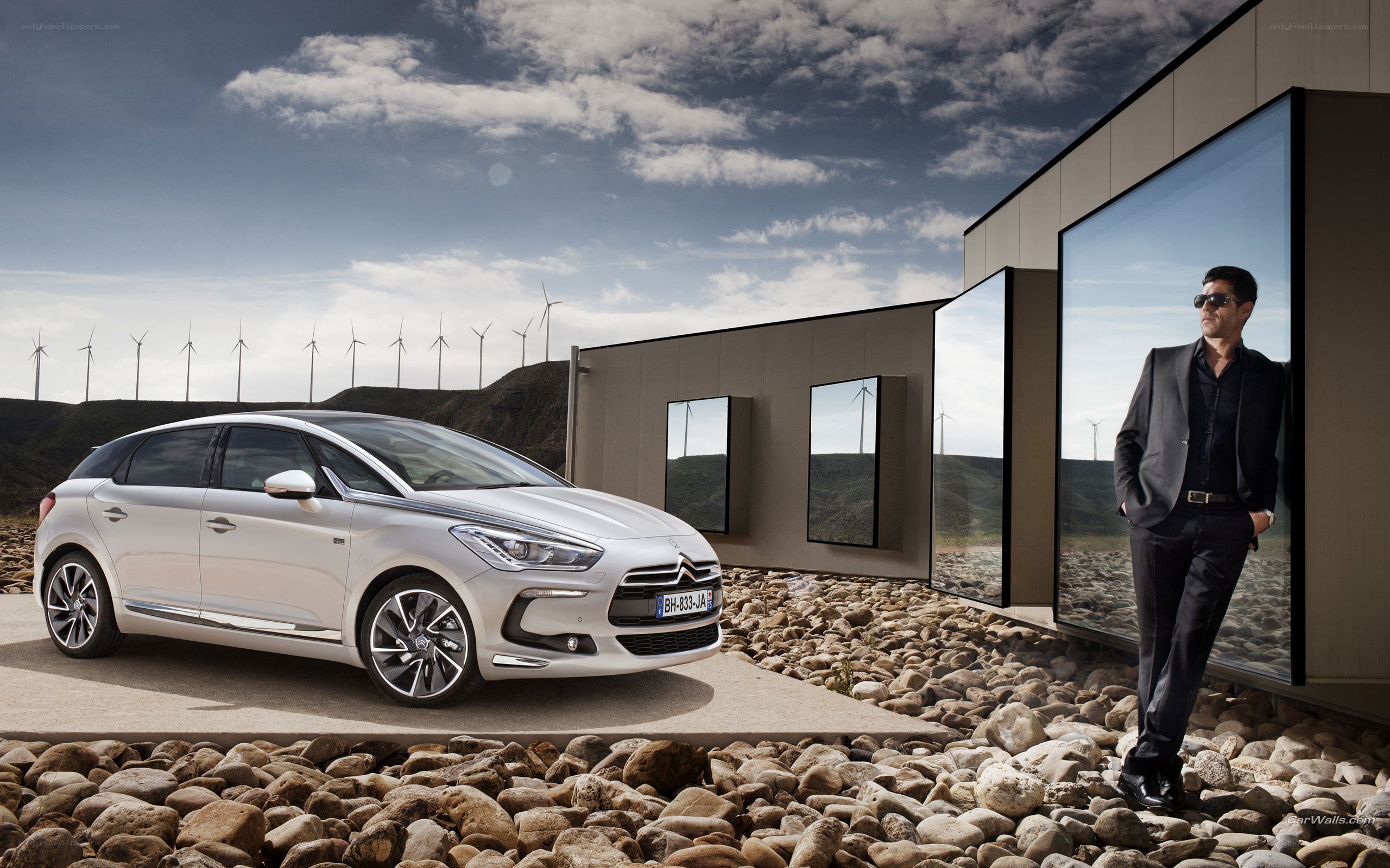 Silver car and man in modern setting