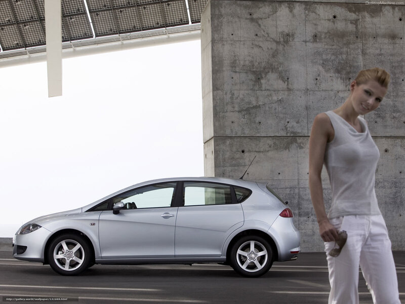 silver car and woman in modern setting