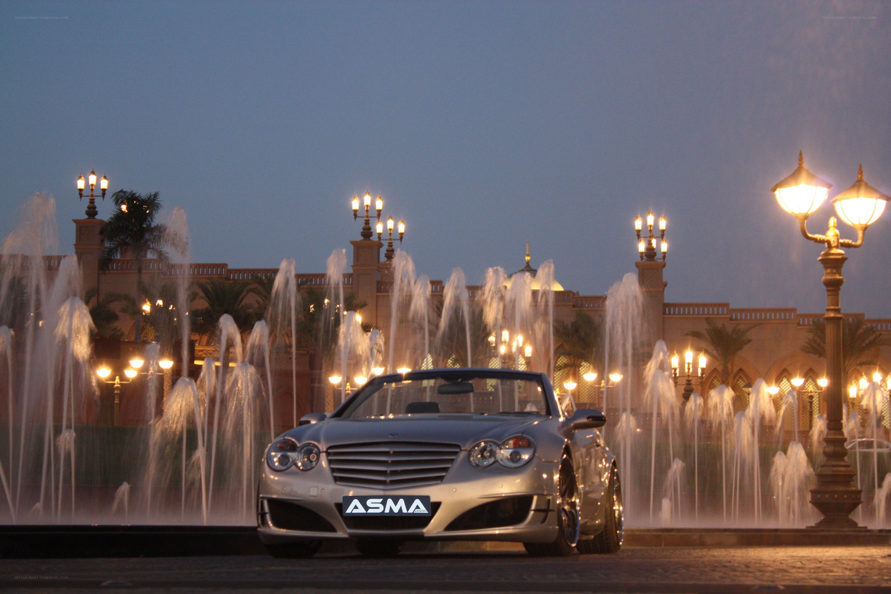 Silver car at fountain display