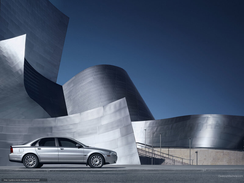 Silver car at modern building