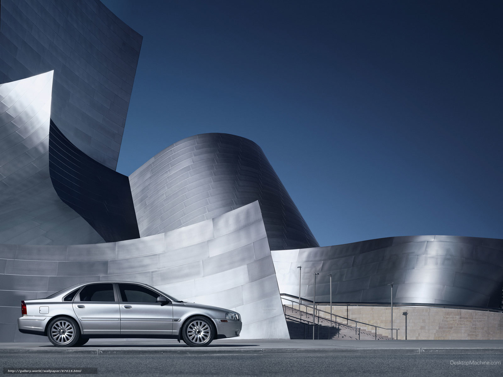 Silver car at modern building