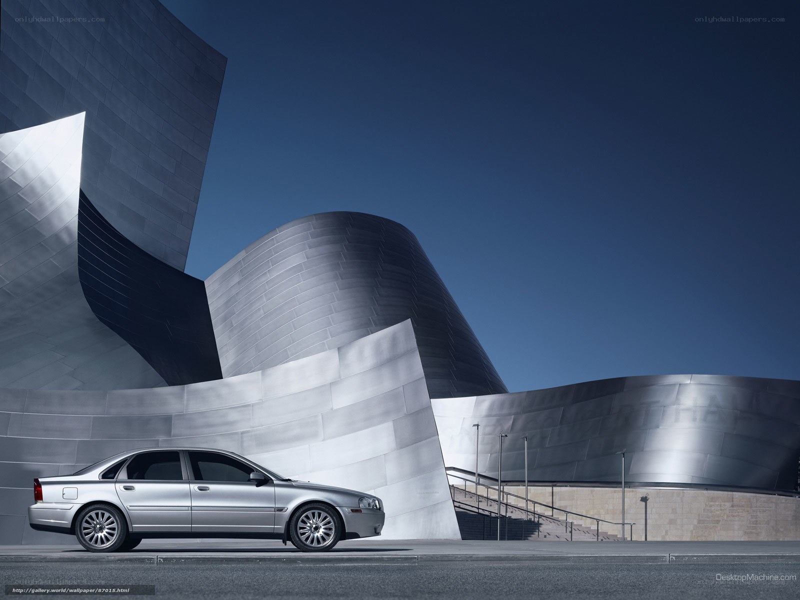 Silver car at modern building
