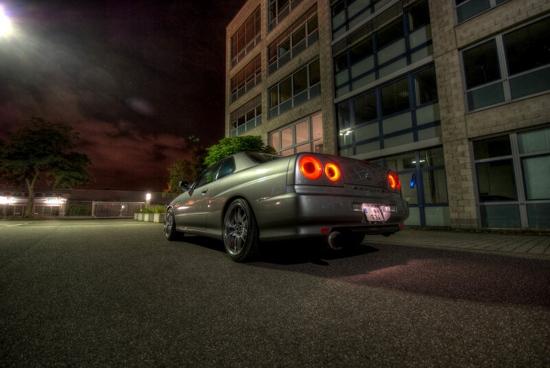 silver car at night in parking lot