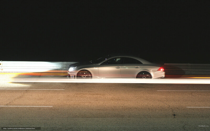 Silver car at night on road