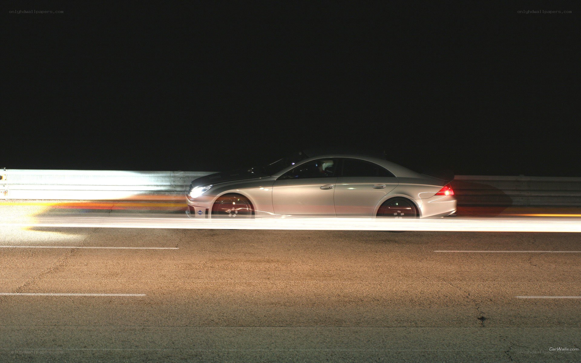 silver car at night on track