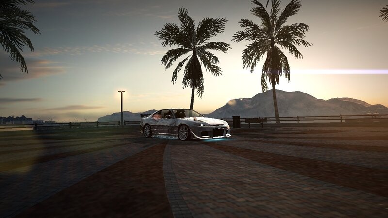 silver car at sunset by the sea