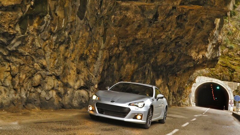 Silver car at tunnel entrance