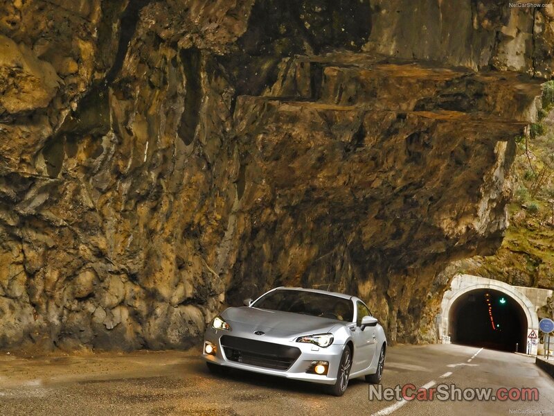 Silver car at tunnel entrance