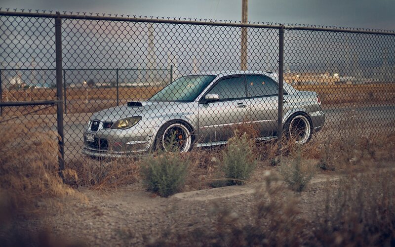 Silver Car Behind Fence — Gray