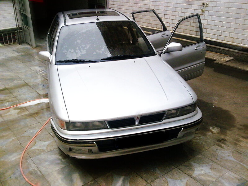 silver car being washed