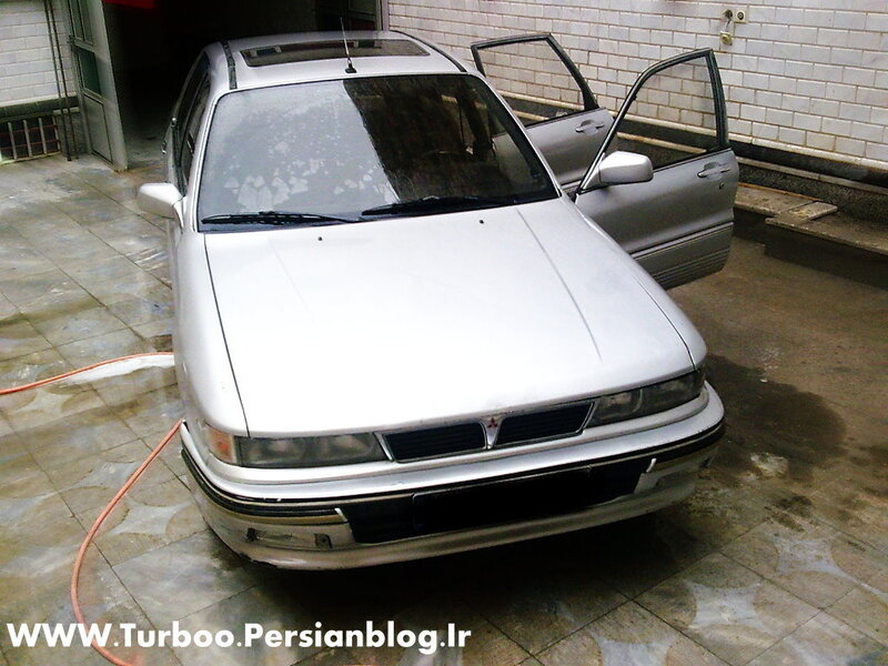 silver car being washed