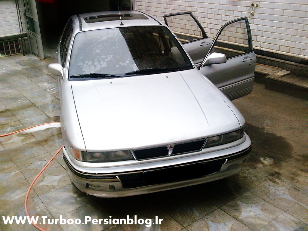 silver car being washed