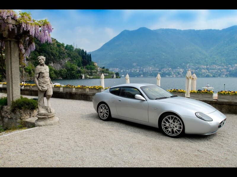 Silver car by a lakeside