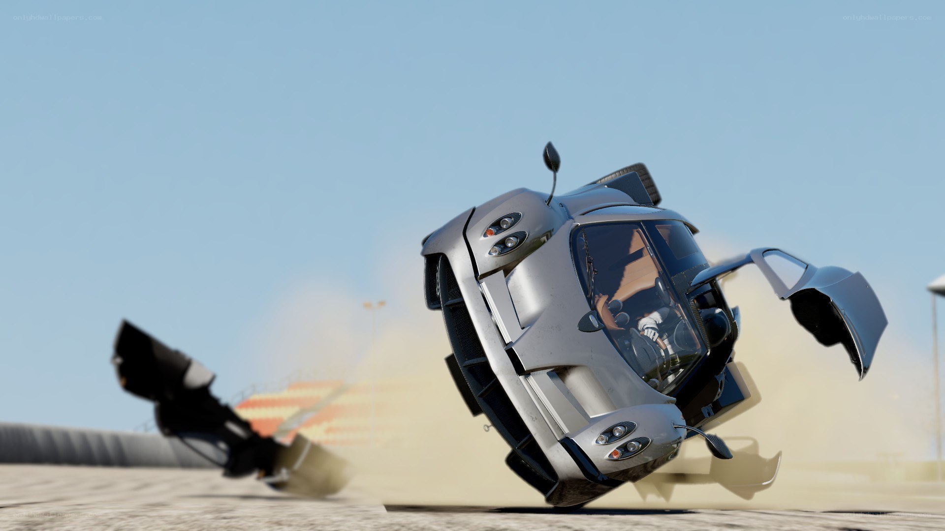 Silver car crash on track