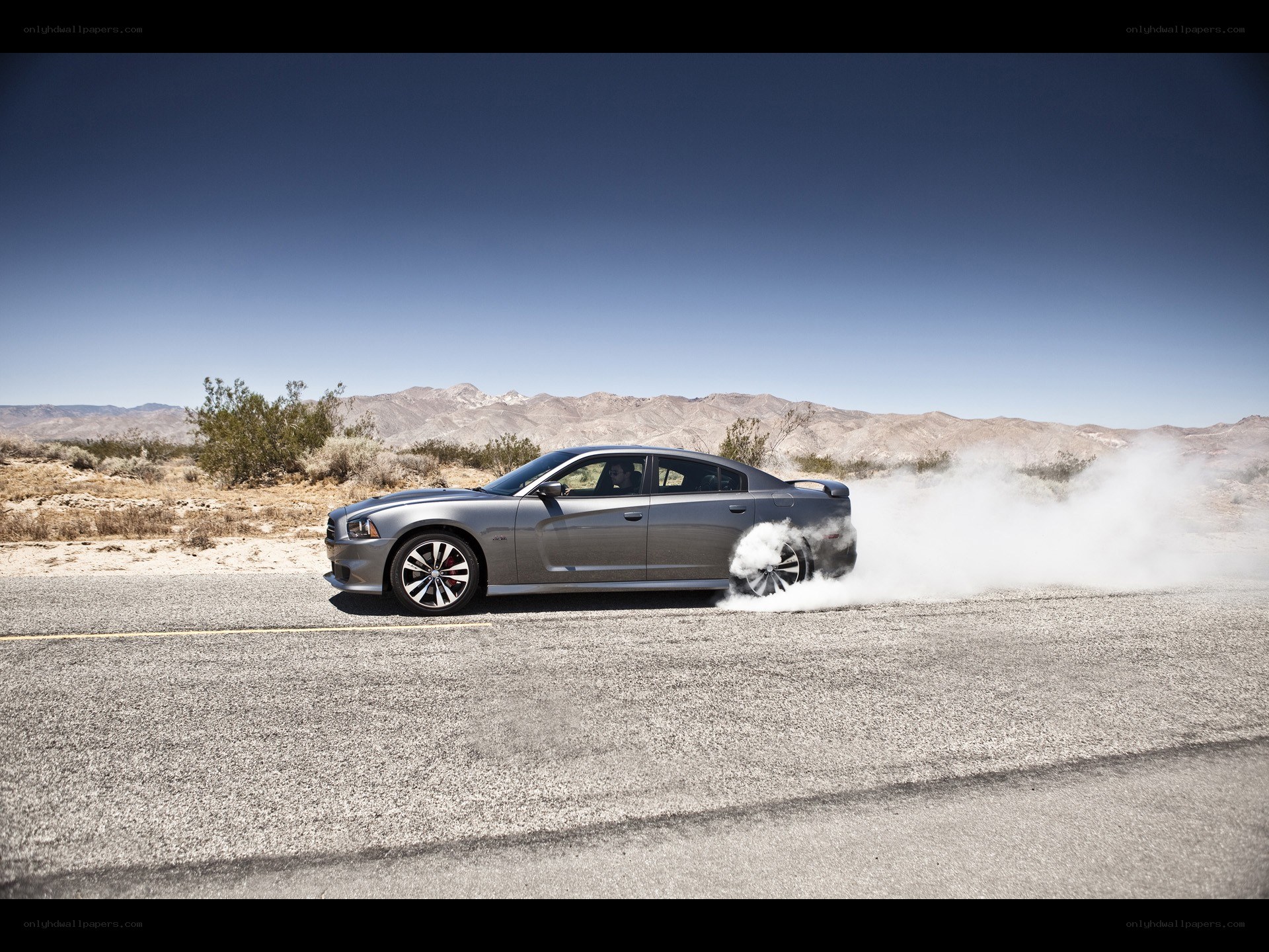 Silver car doing burnout