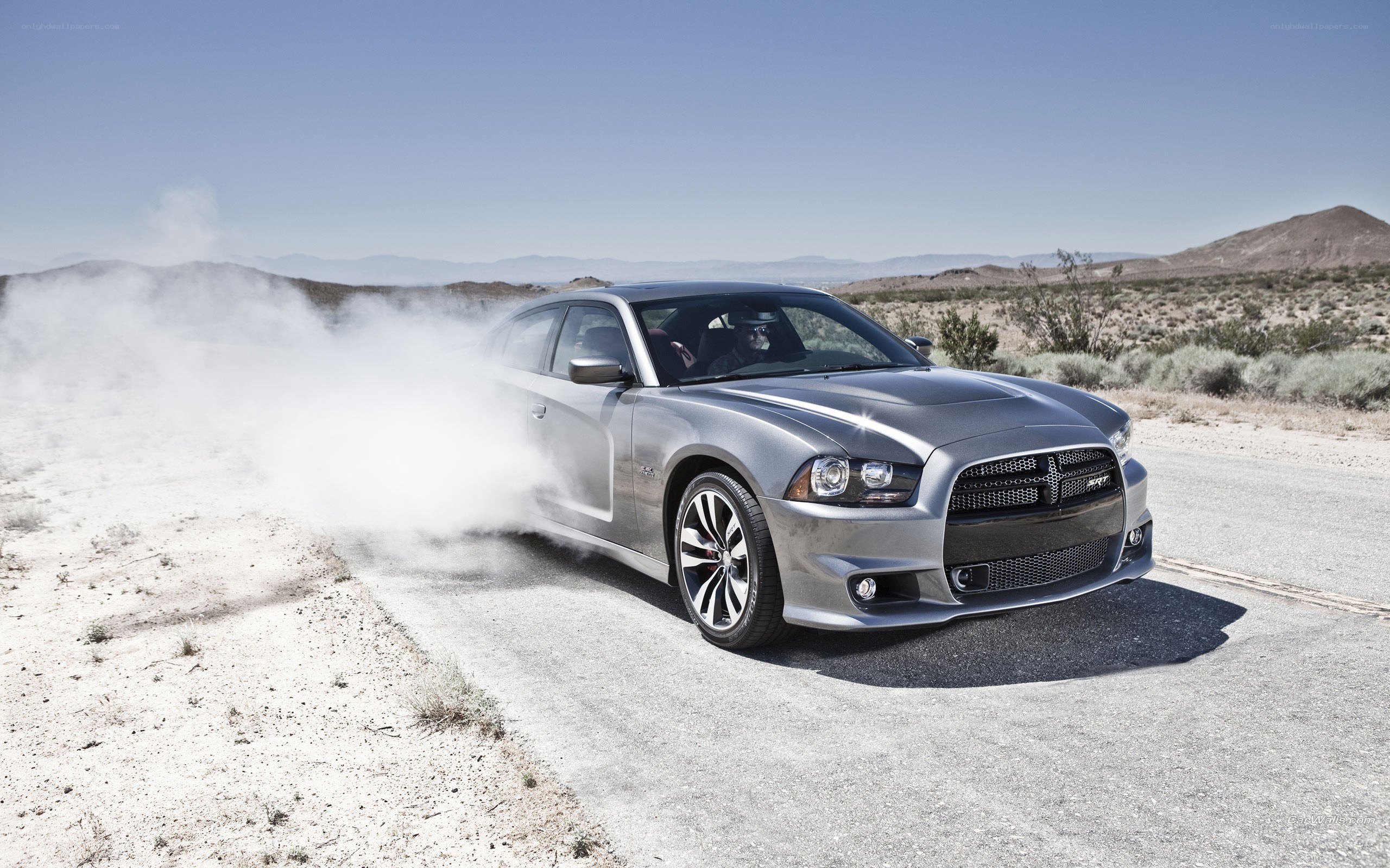 silver car drifting in desert