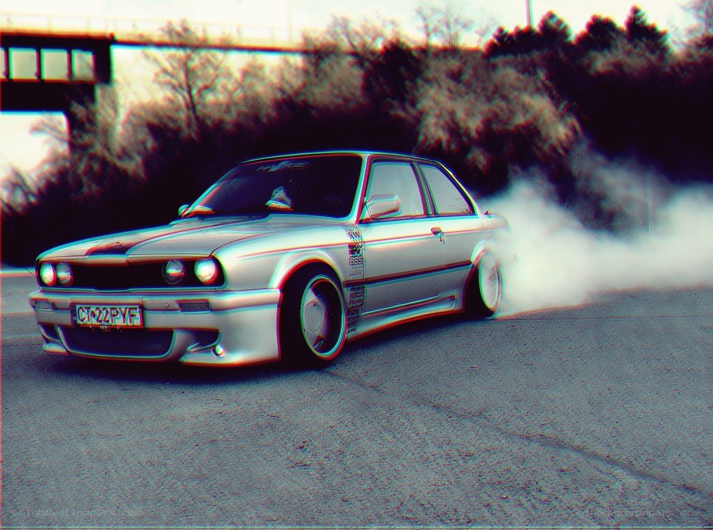 silver car drifting on road