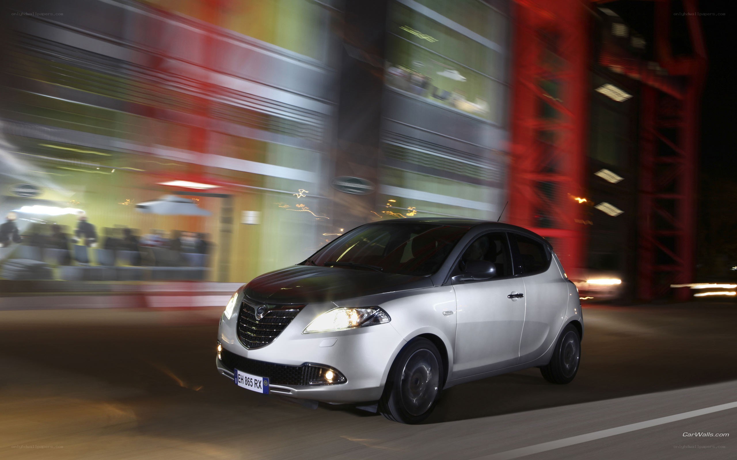 silver car driving at night