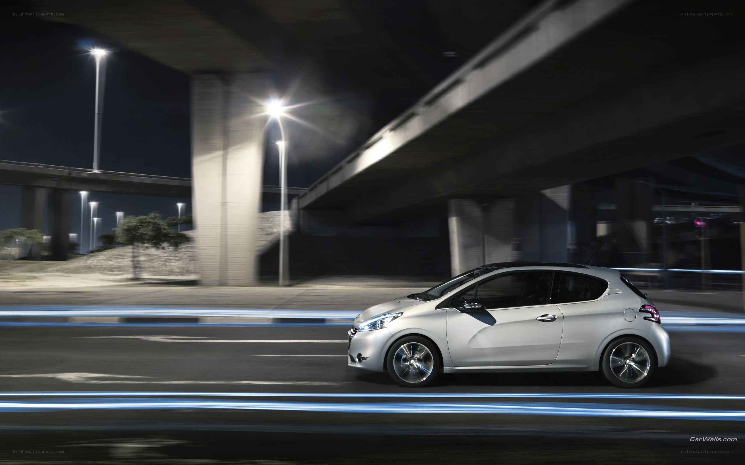 Silver car driving at night