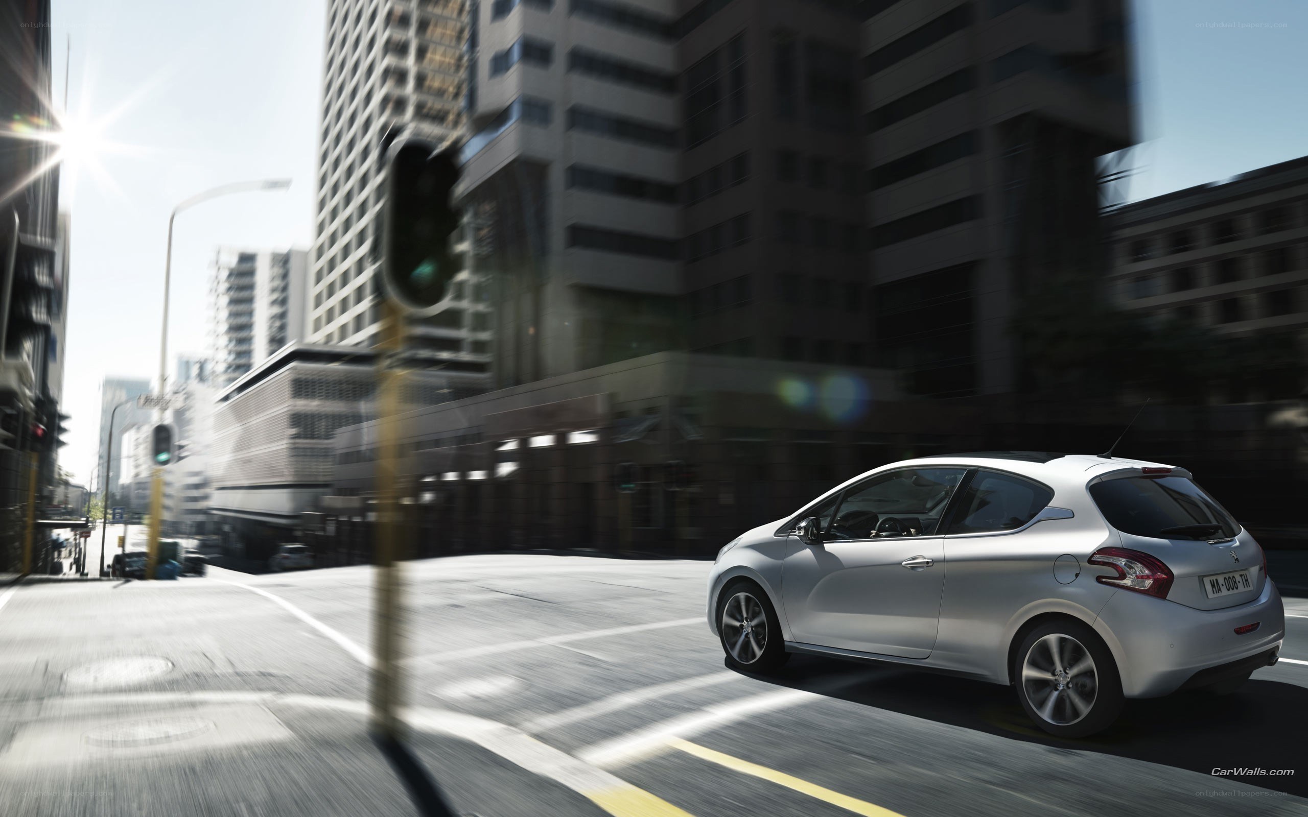 Silver car driving in city
