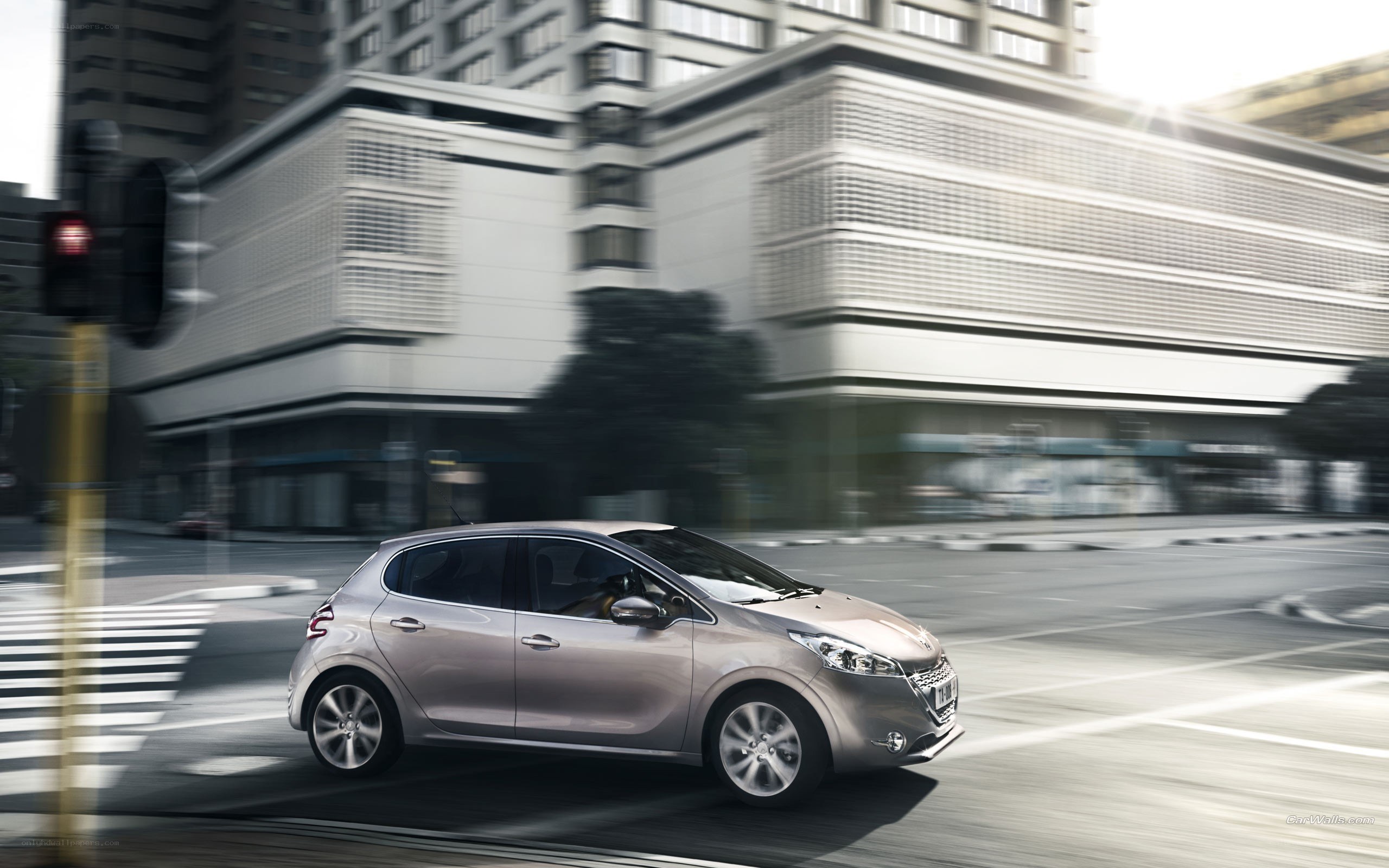 Silver car driving in city