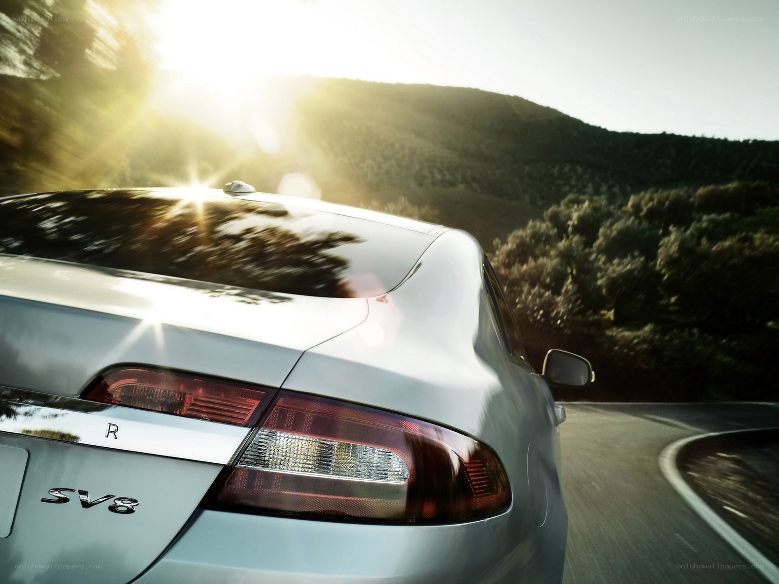 silver car driving on road