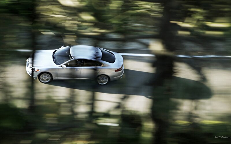 silver car driving on road