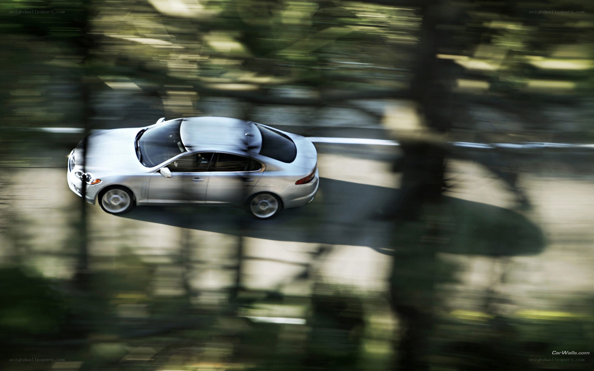 silver car driving on road