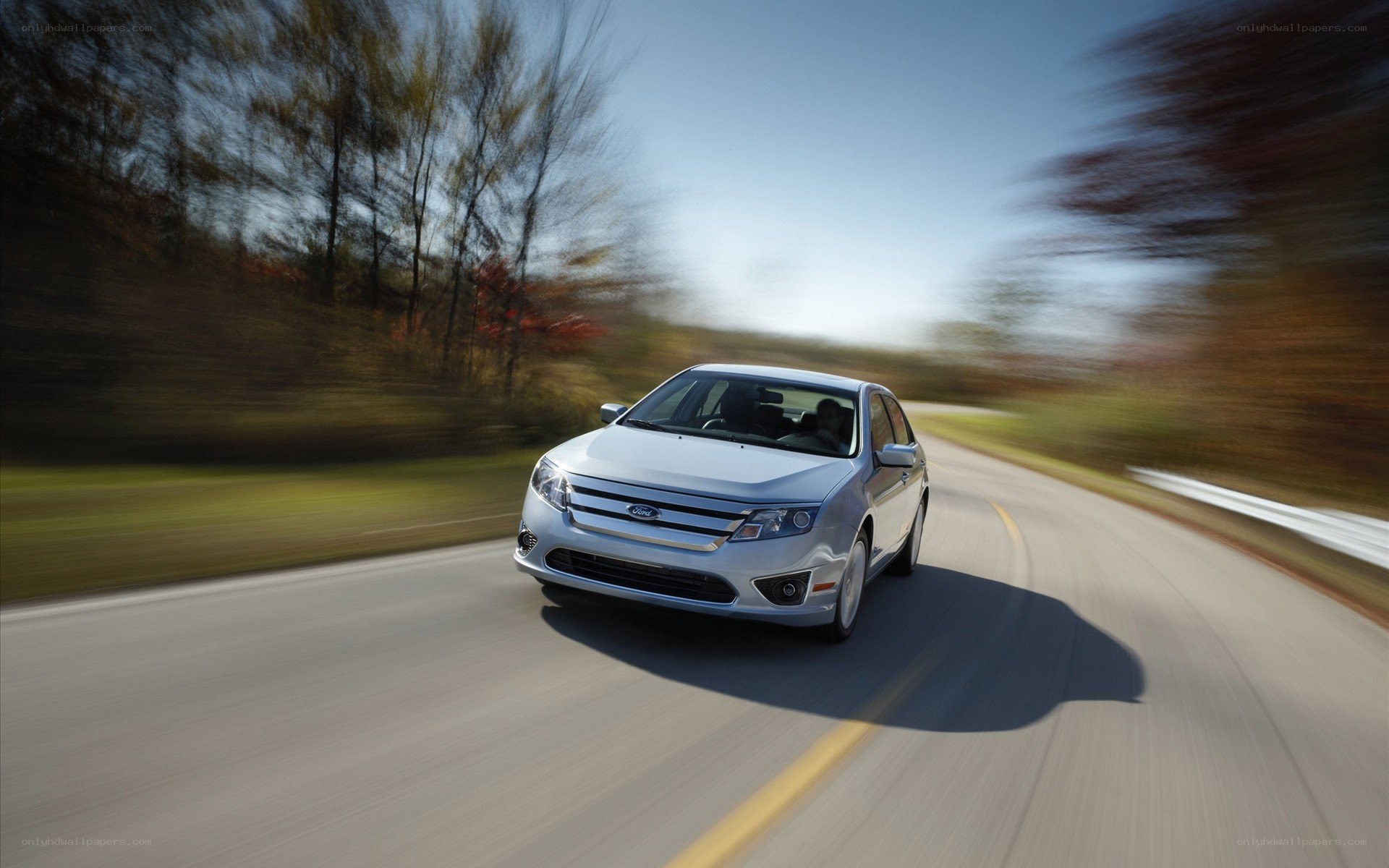 silver car driving on road