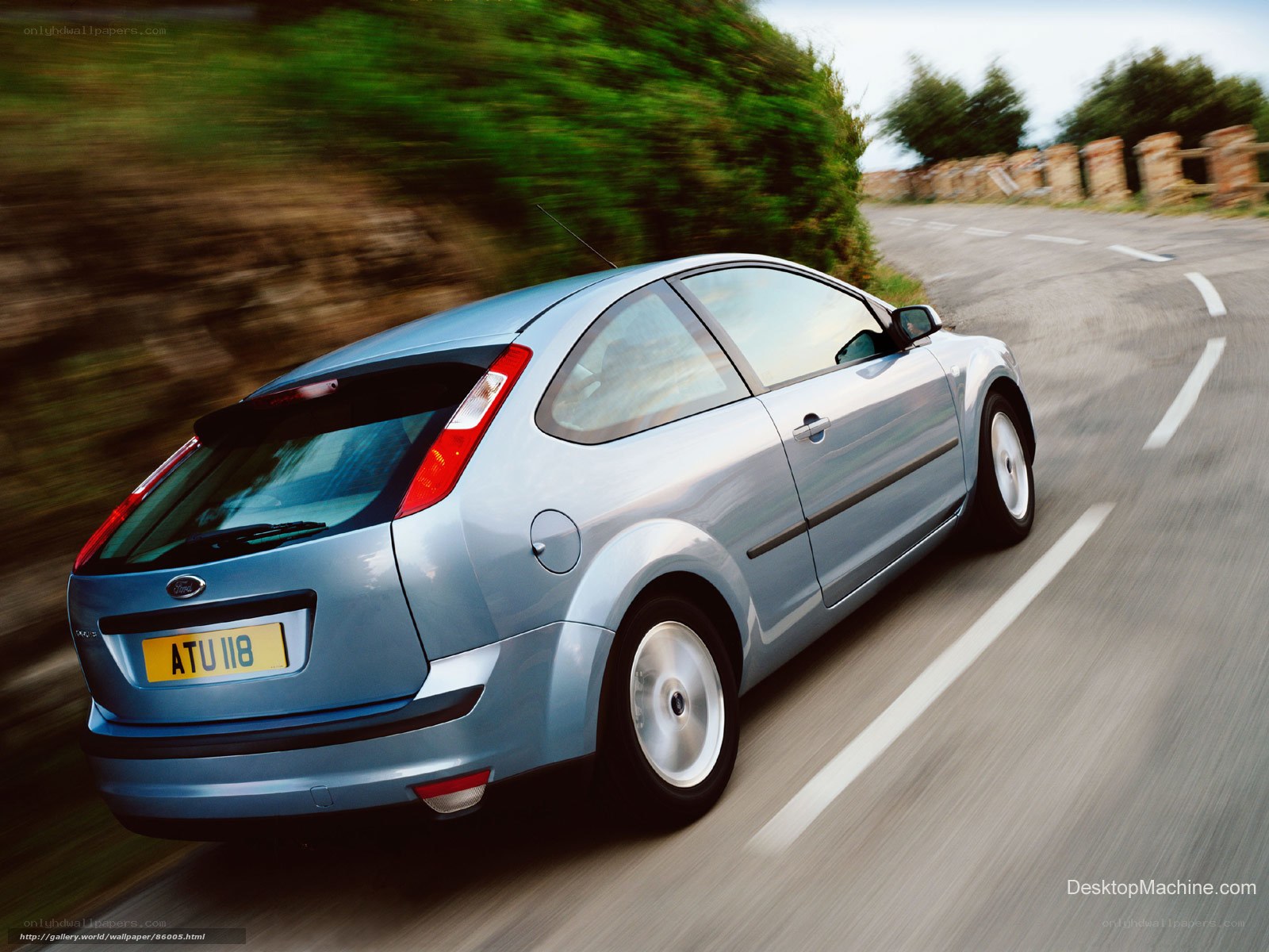 silver car driving on road