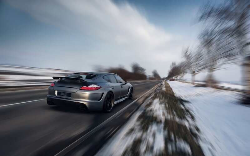 silver car driving on snowy road