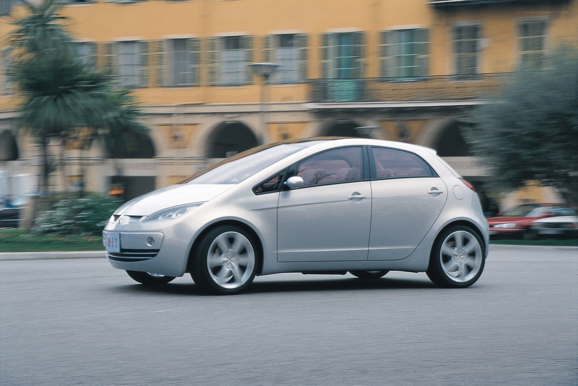 silver car driving on street